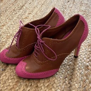 Cole Haan lace up high heel bootie.